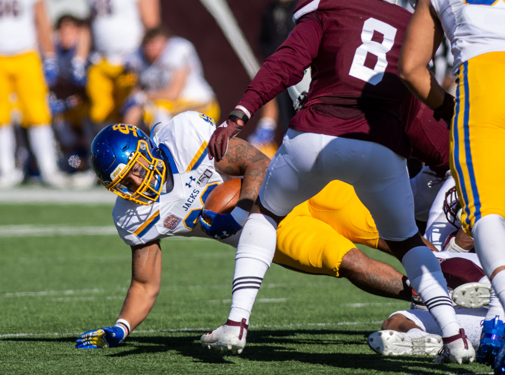 Missouri State's defense takes a South Dakota State offensive player down
